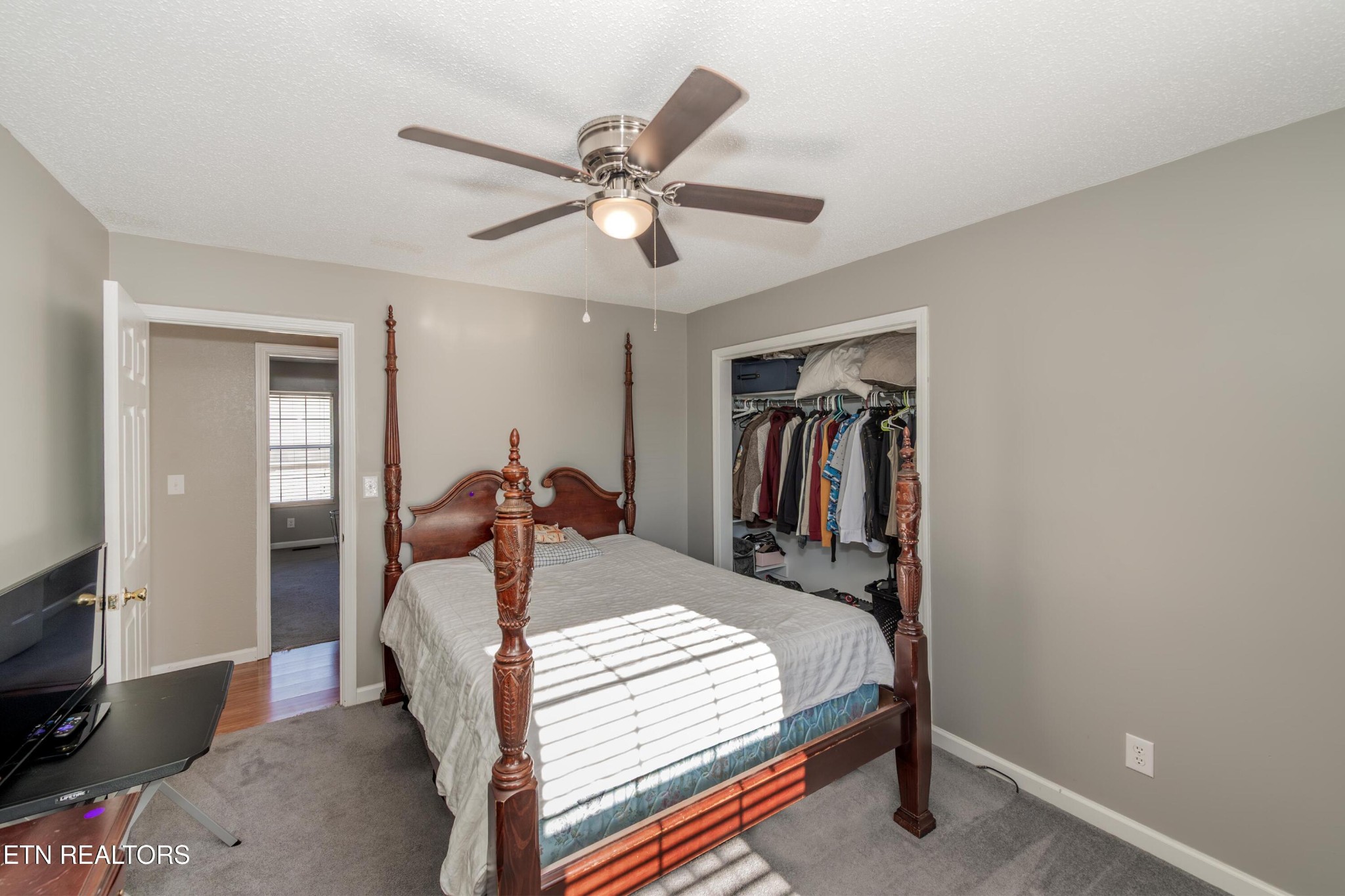 3919 Morganton Road Maryville, TN 37801 - Photo 26 of 29 a bed room with a bed and a chandelier