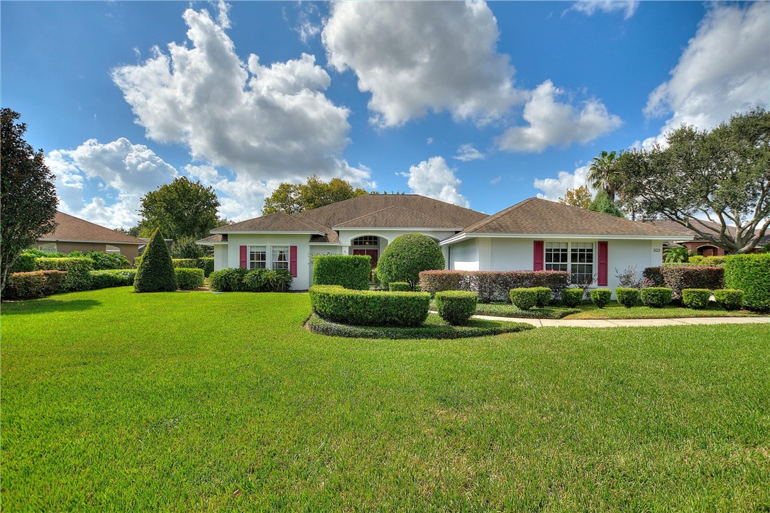 5521 Emerald Ridge Boulevard Lakeland, FL 33813 - Photo 1 of 33 a view of an house with backyard and garden