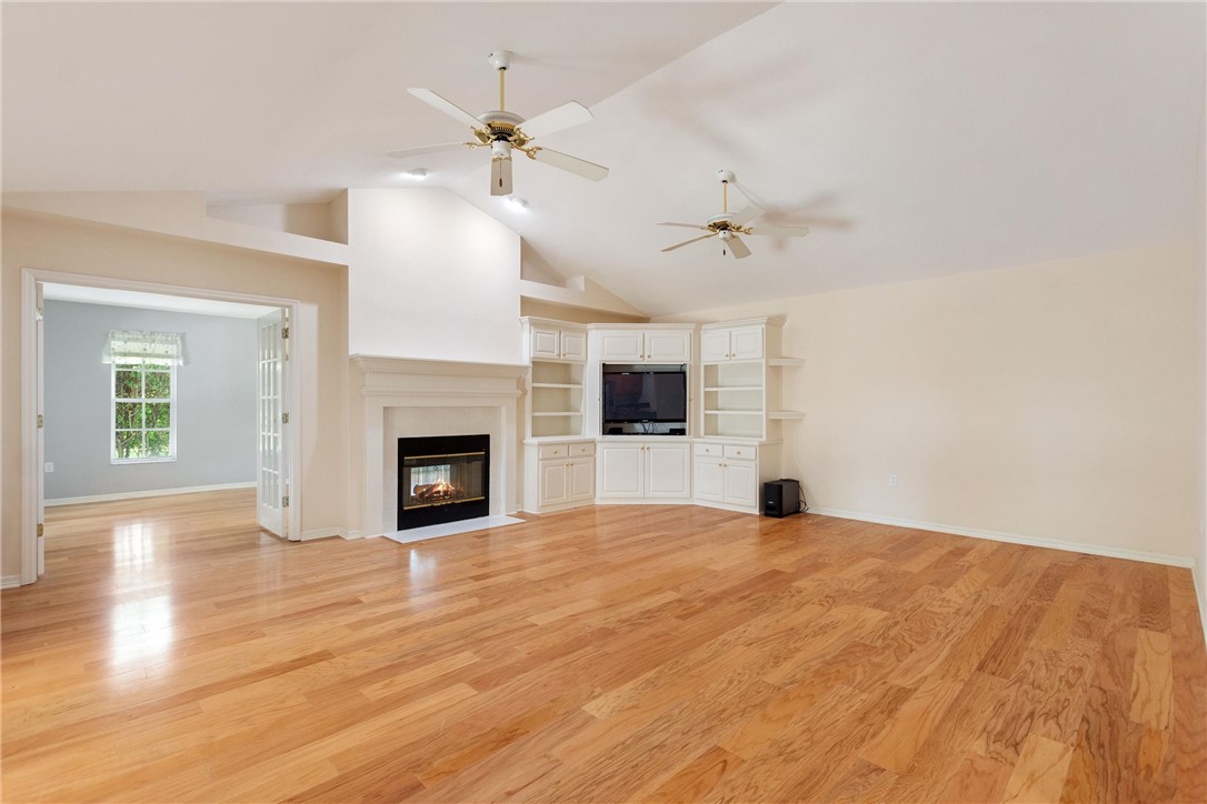 5521 Emerald Ridge Boulevard Lakeland, FL 33813 - Photo 12 of 33 a view of an empty room with a fireplace and a window