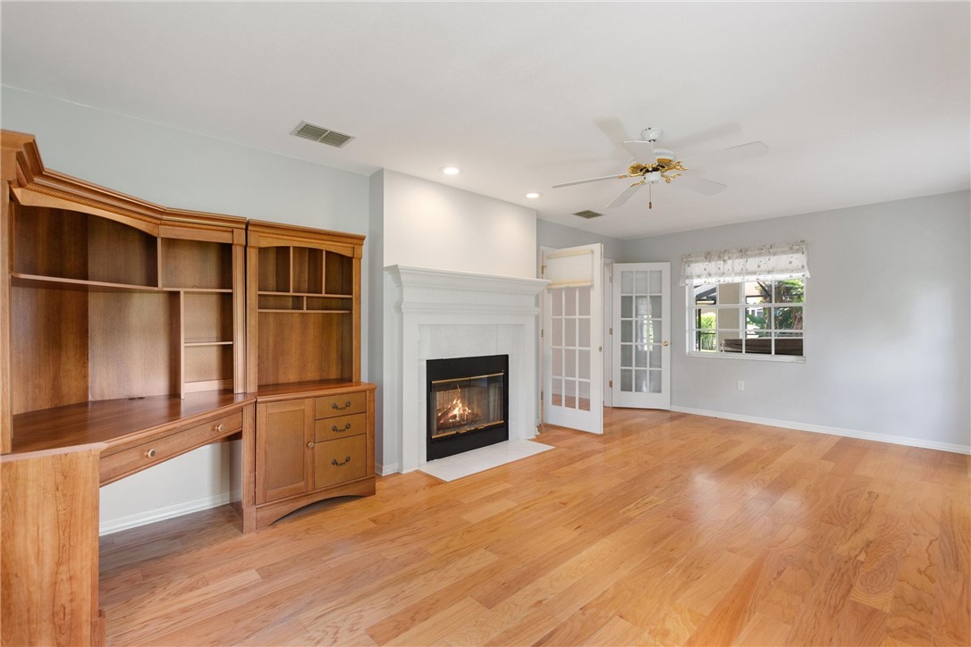5521 Emerald Ridge Boulevard Lakeland, FL 33813 - Photo 15 of 33 a view of an empty room with a fireplace and a window