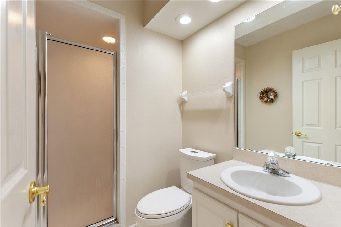 5521 Emerald Ridge Boulevard Lakeland, FL 33813 - Photo 22 of 33 a bathroom with a sink toilet and shower