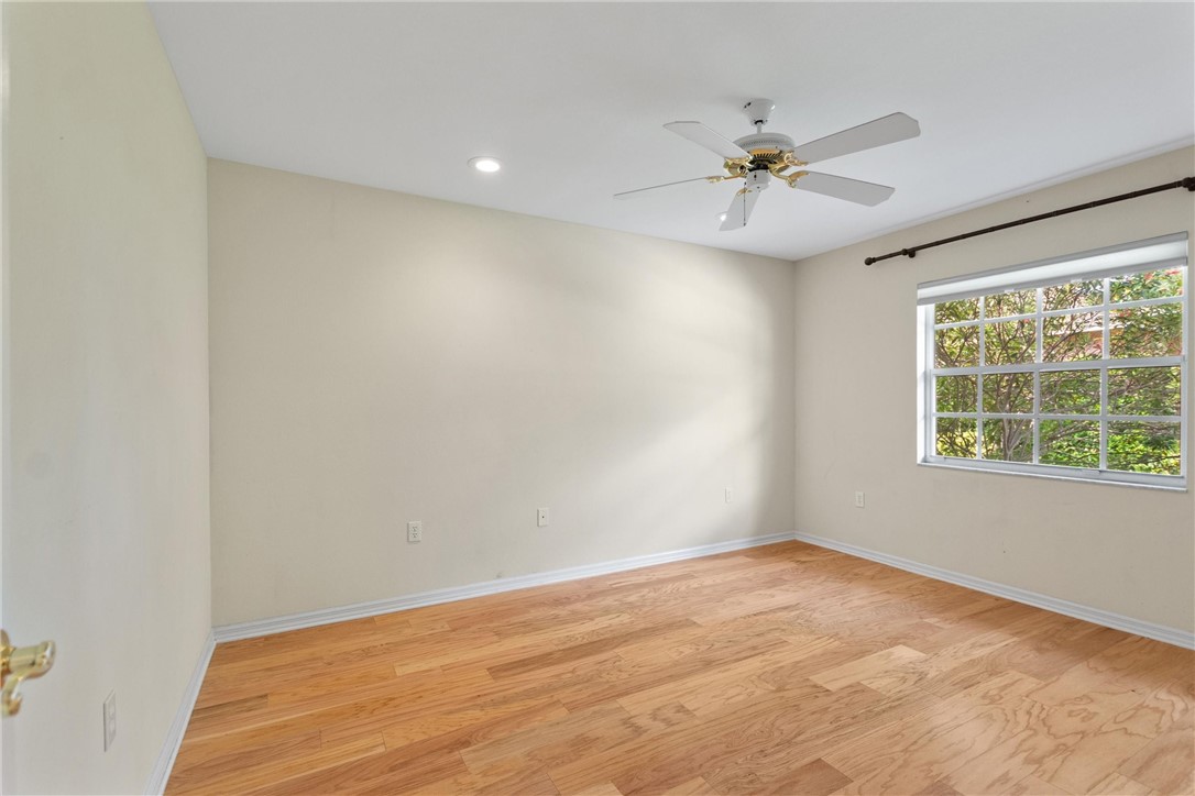 5521 Emerald Ridge Boulevard Lakeland, FL 33813 - Photo 24 of 33 wooden floor in an empty room with a window