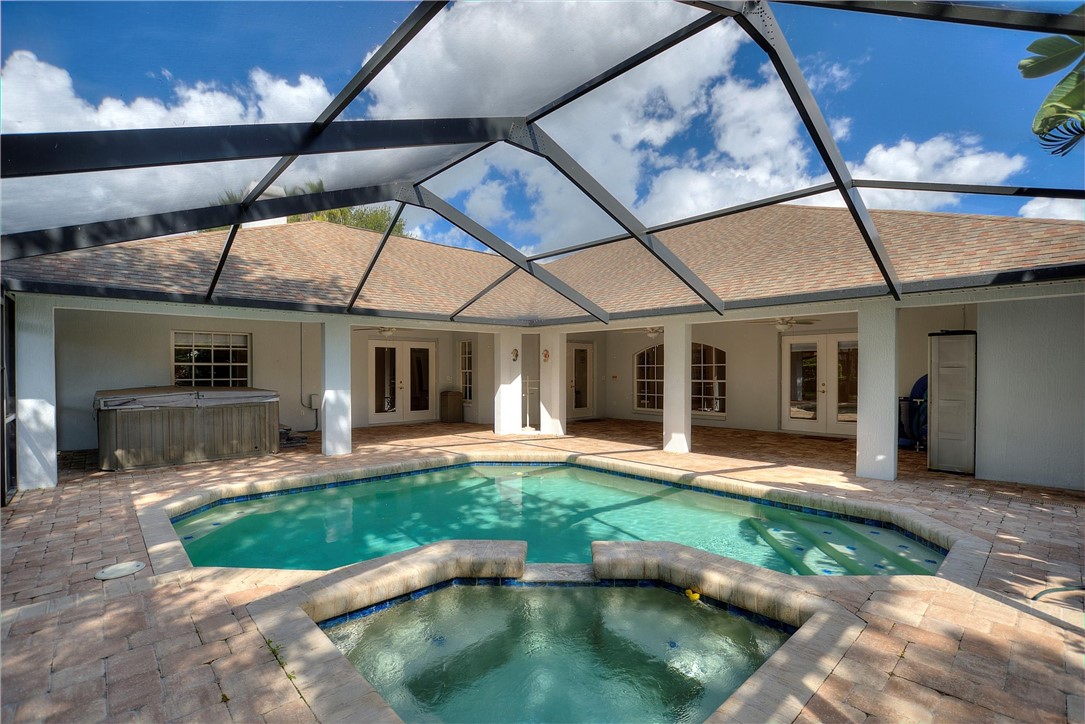 5521 Emerald Ridge Boulevard Lakeland, FL 33813 - Photo 29 of 33 a view of a house with backyard porch and sitting area