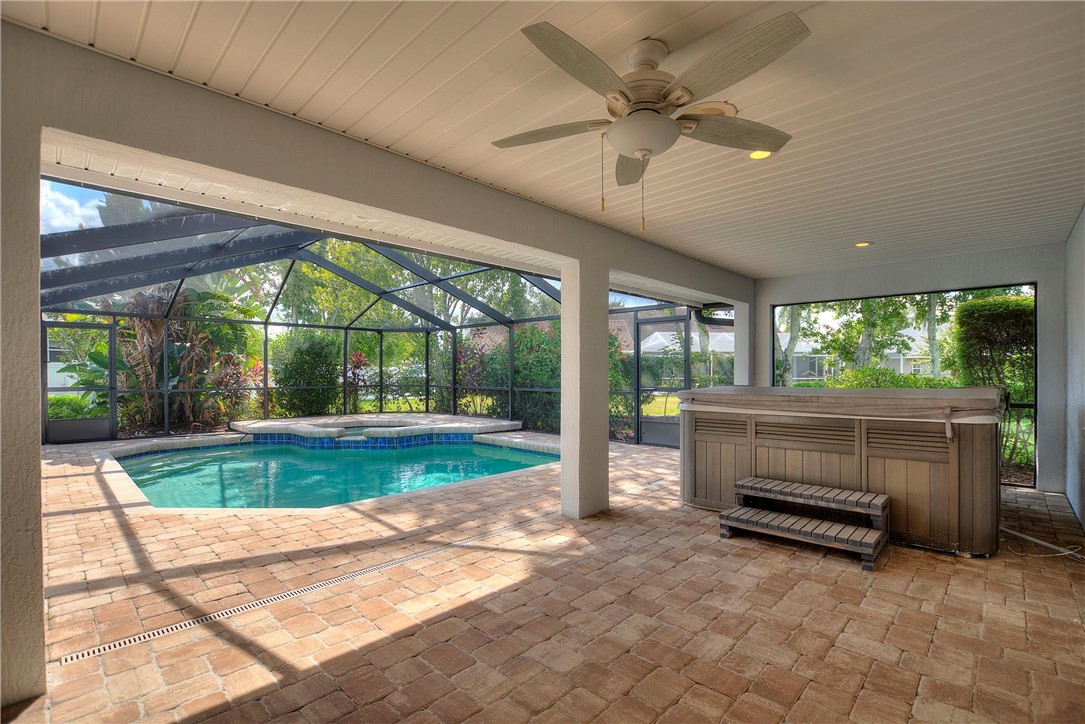 5521 Emerald Ridge Boulevard Lakeland, FL 33813 - Photo 31 of 33 a view of backyard with large windows and a swimming pool