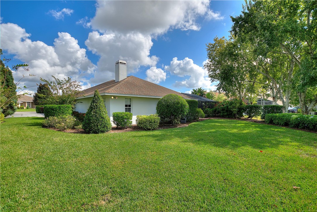 5521 Emerald Ridge Boulevard Lakeland, FL 33813 - Photo 33 of 33 a view of a house with a yard