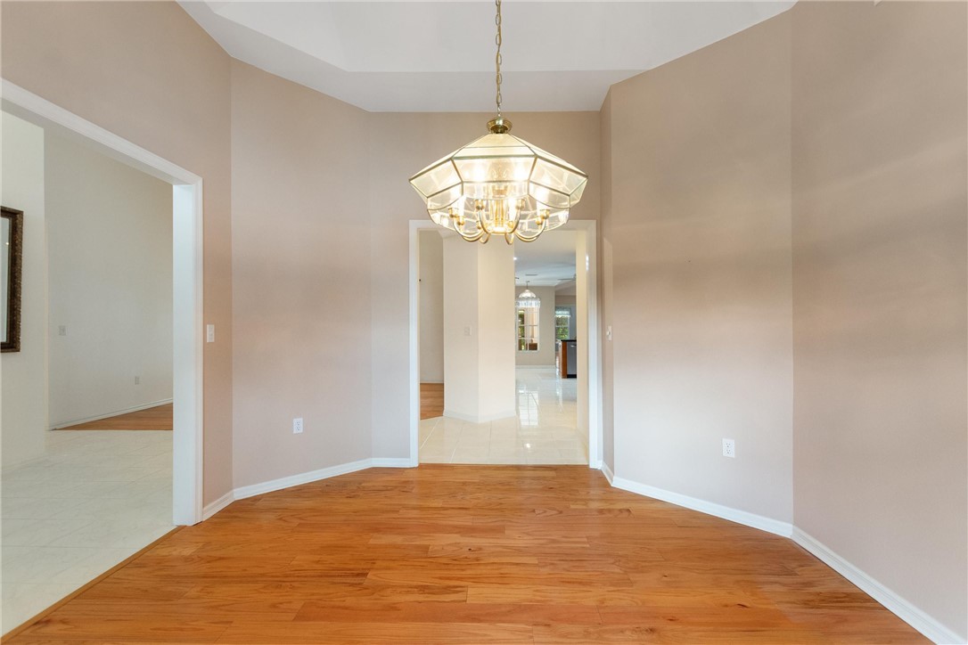 5521 Emerald Ridge Boulevard Lakeland, FL 33813 - Photo 7 of 33 a view of empty room with wooden floor and fan