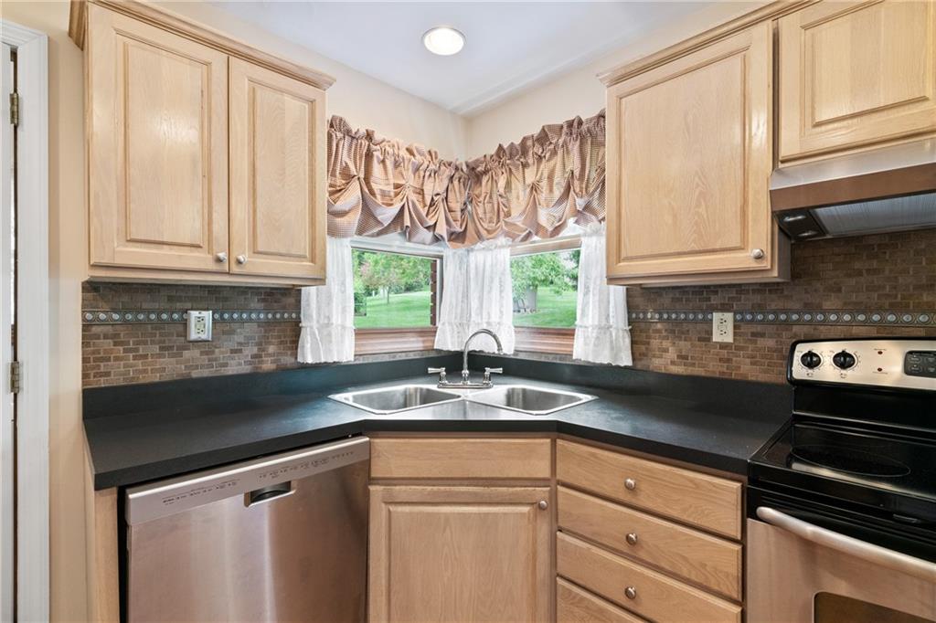 138 Valley Road Eighty Four, PA 15330 - Photo 11 of 33 a kitchen with granite countertop a sink and a window