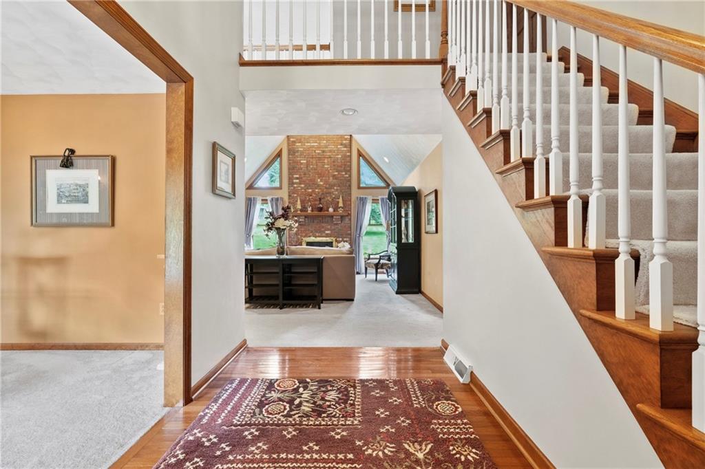 138 Valley Road Eighty Four, PA 15330 - Photo 4 of 33 a view of a hallway with wooden floor and staircase