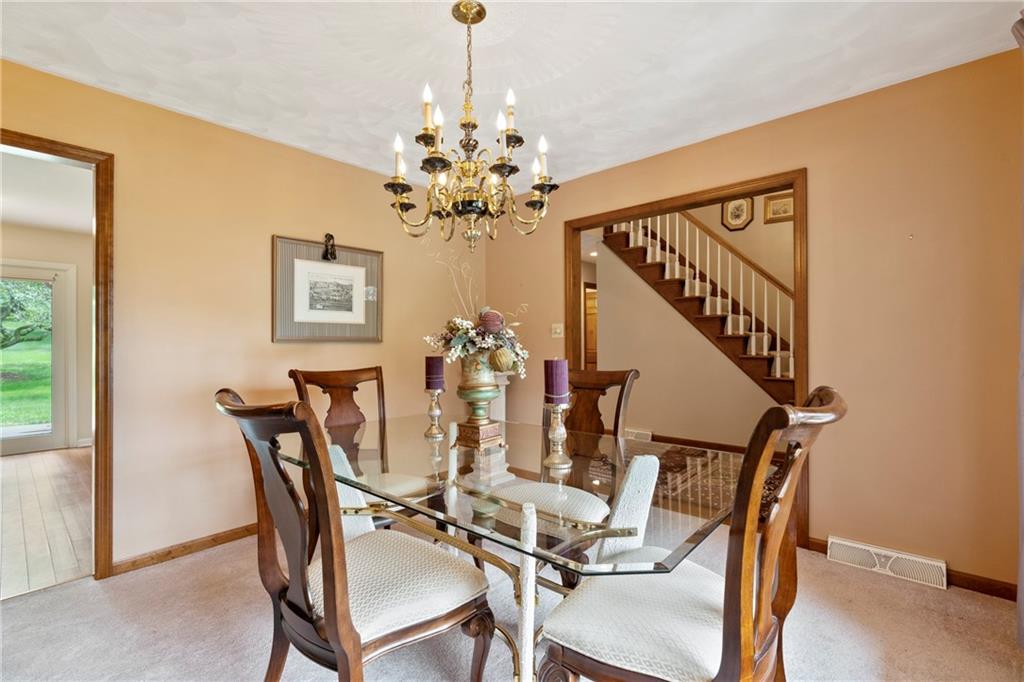 138 Valley Road Eighty Four, PA 15330 - Photo 6 of 33 a view of a dining room with furniture and chandelier