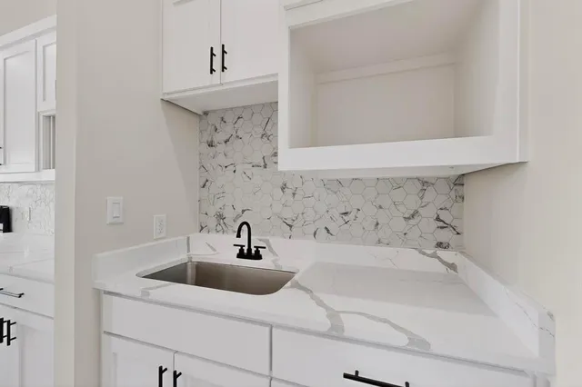 a bathroom with a sink and vanity