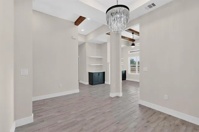 a view of a livingroom with wooden floor