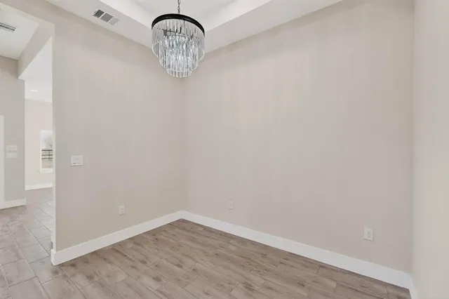 a view of a livingroom with wooden floor