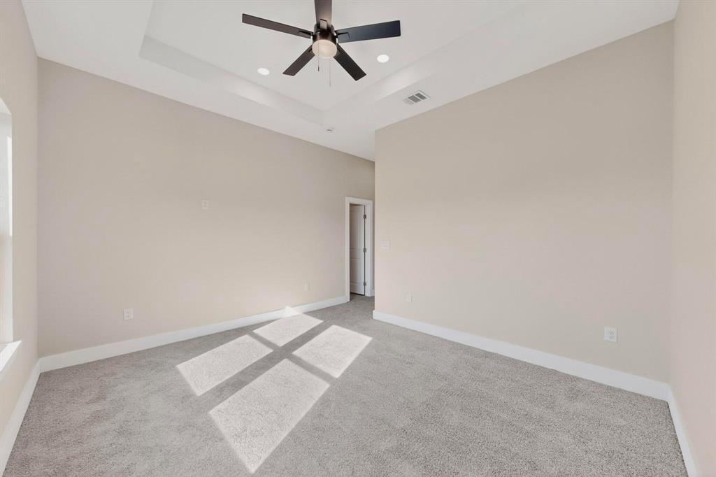 100 Diamond T Ranch Road Trinidad, TX 75163 - Photo 19 of 36 an empty room with a ceiling fan and window
