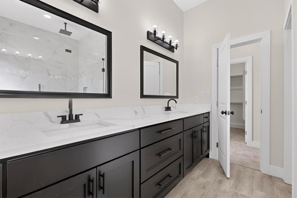 100 Diamond T Ranch Road Trinidad, TX 75163 - Photo 20 of 36 a bathroom with double sink and a mirror