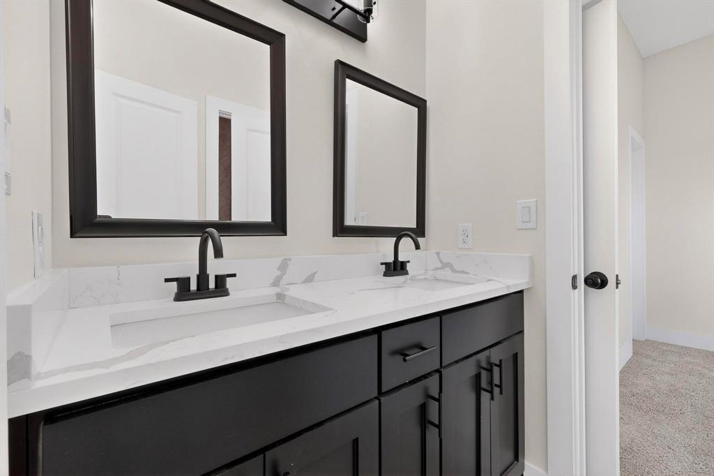 100 Diamond T Ranch Road Trinidad, TX 75163 - Photo 24 of 36 a bathroom with 2 sink and a mirror