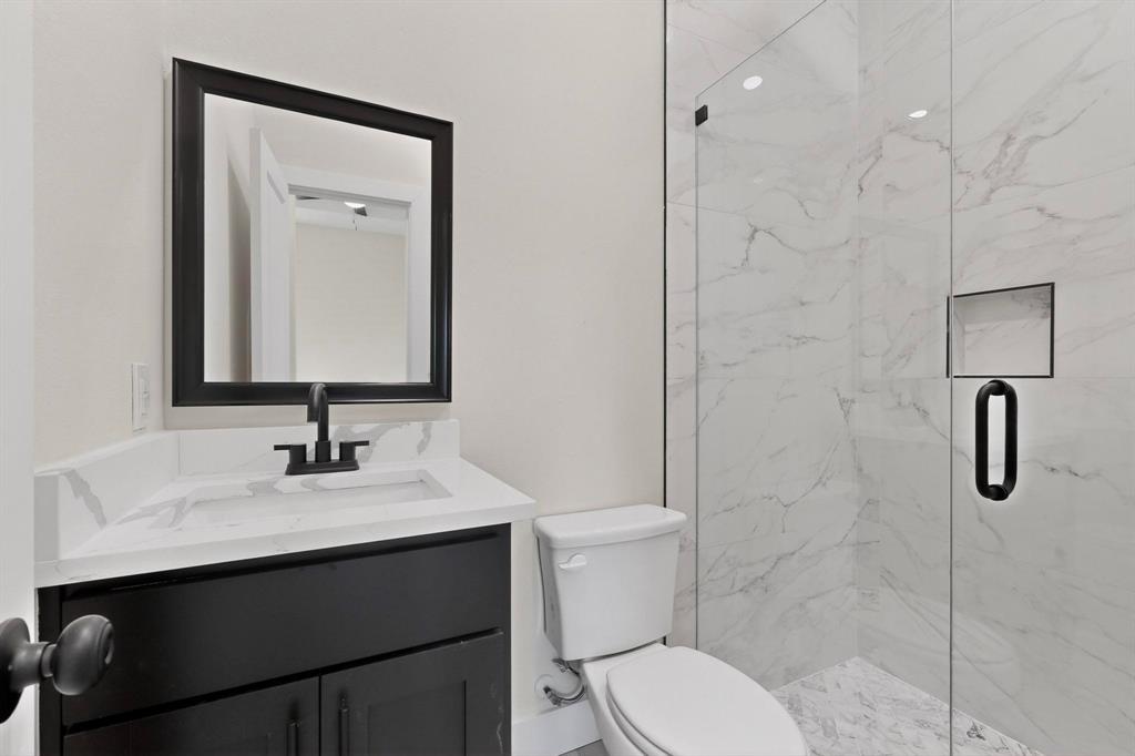 100 Diamond T Ranch Road Trinidad, TX 75163 - Photo 30 of 36 a bathroom with a toilet sink shower and mirror