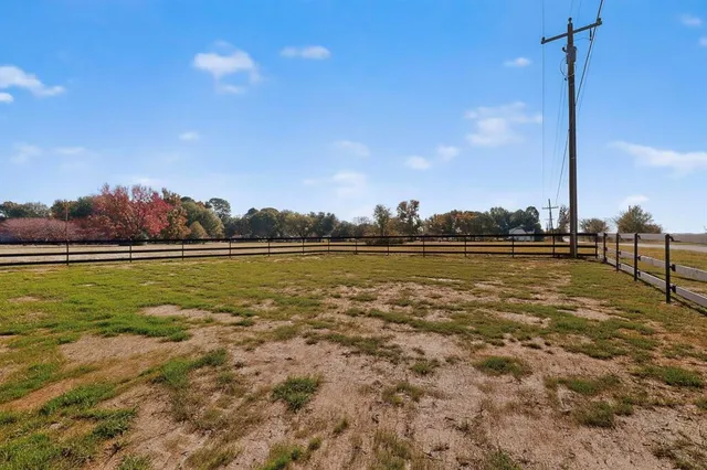 a view of a lake with houses in the background