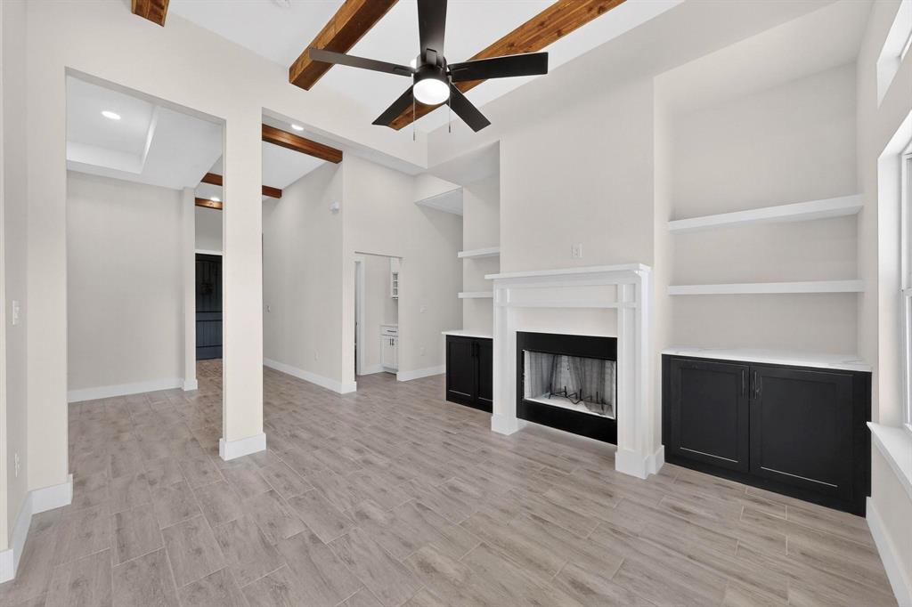100 Diamond T Ranch Road Trinidad, TX 75163 - Photo 6 of 36 a view of a livingroom with a fireplace and a ceiling fan