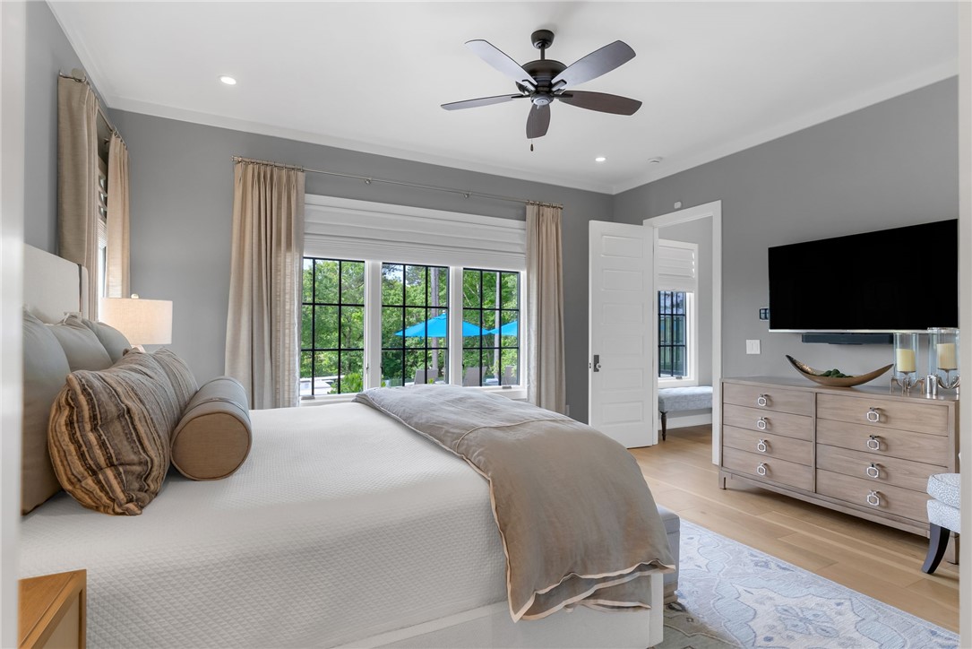 119 Drewberry Lane Sunset, SC 29685 - Photo 14 of 42 This spacious bedroom offers serene views, high ceilings, and light hardwood flooring.