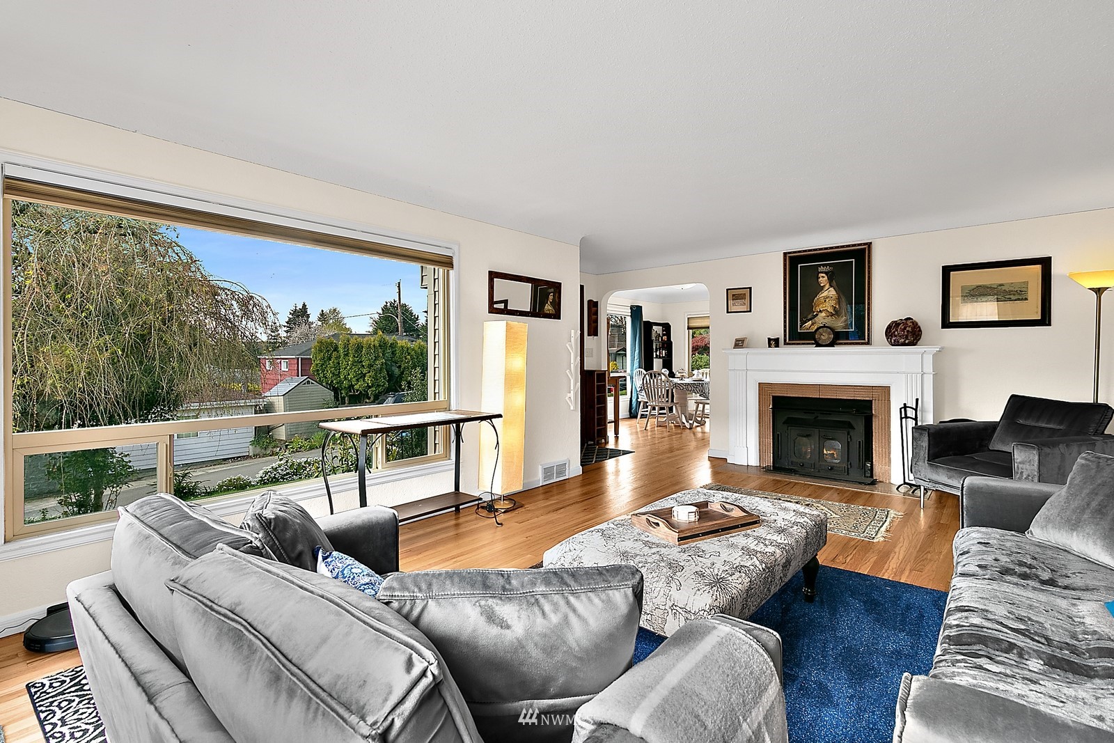 516 Southwest Langston Place Renton, WA 98057 - Photo 9 of 32 a living room with furniture fireplace and a large window