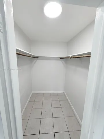 a bathroom with a sink mirror and toilet