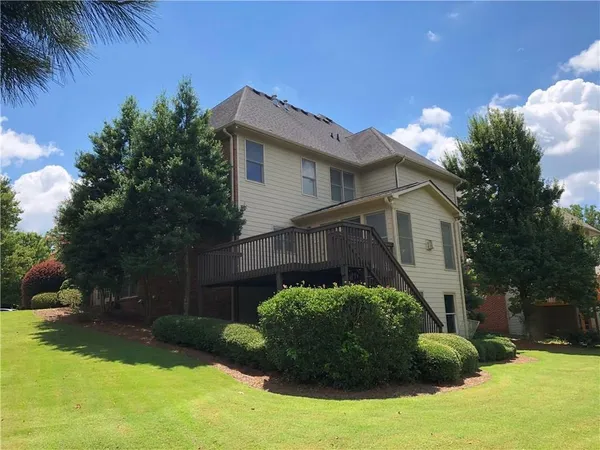 a view of a house with a garden