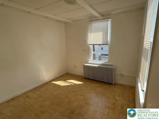 a view of an empty room and window