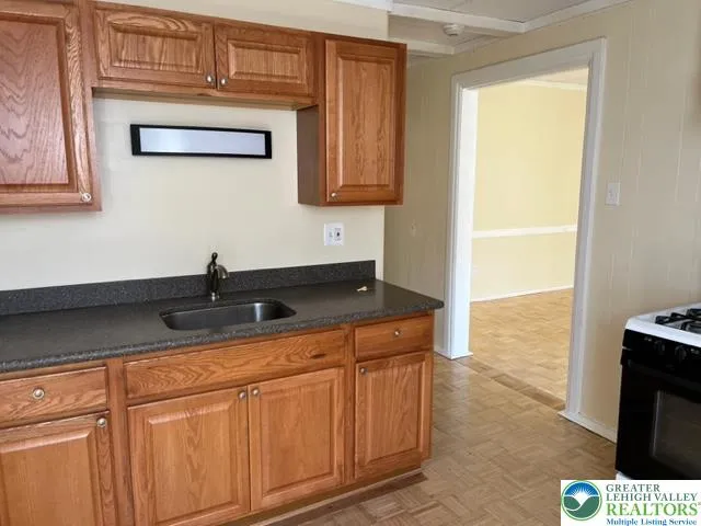 a kitchen with a sink and cabinets