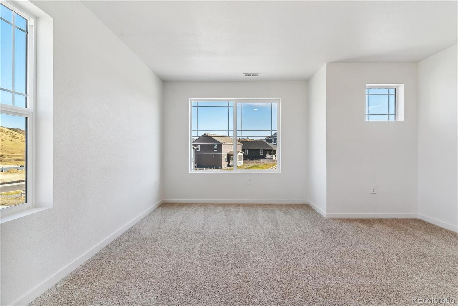 2220 Base Street Fort Lupton, CO 80621 - Photo 27 of 36 a view of an empty room with a window