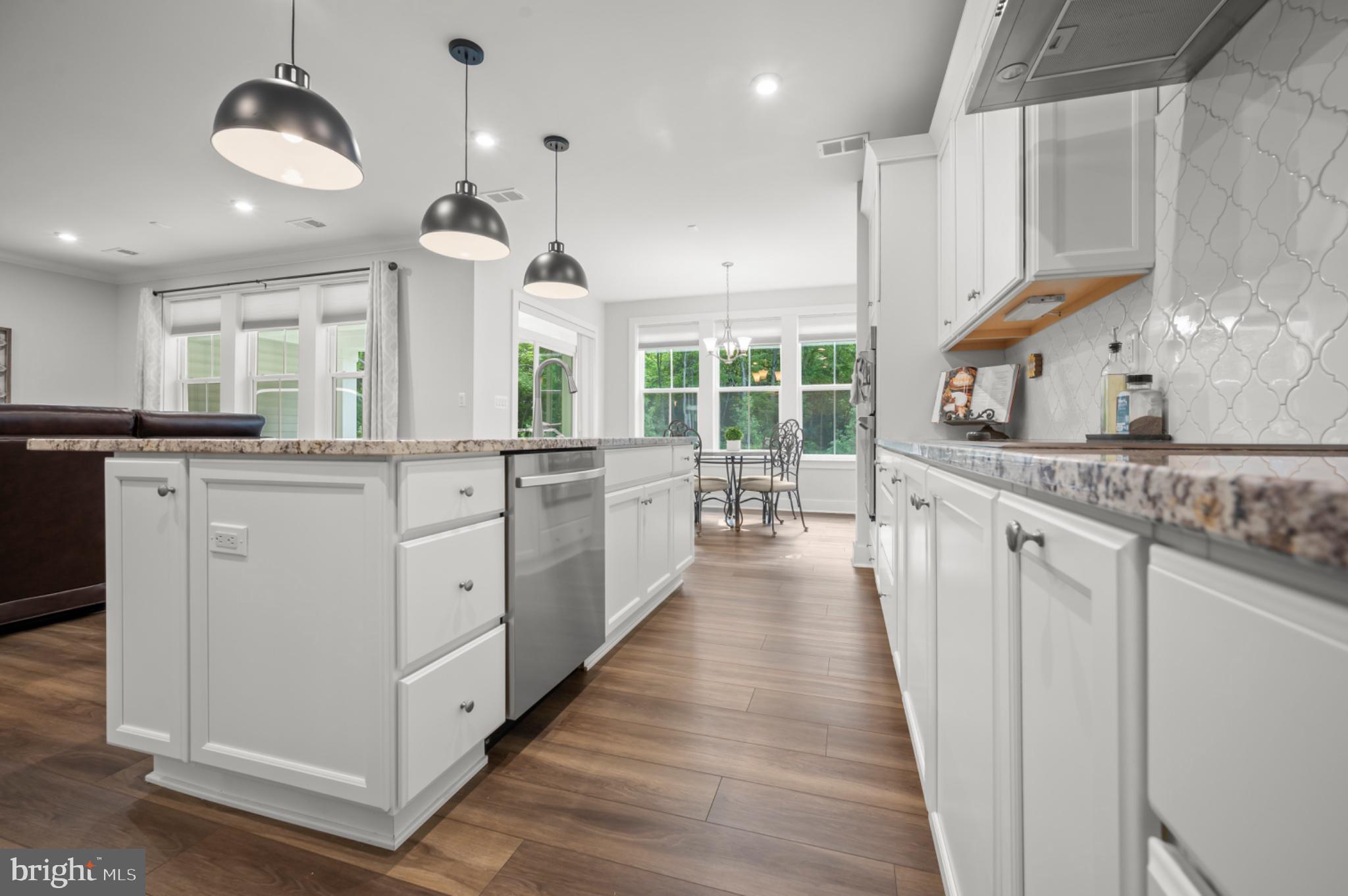 8702 Southrun Road Lorton, VA 22079 - Photo 12 of 35 Bright white kitchen with granite counters
