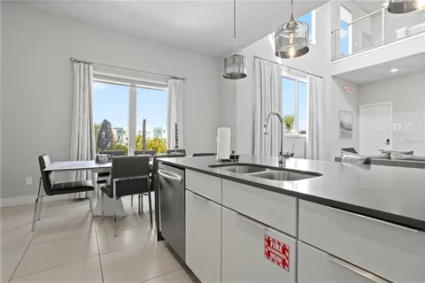 a bedroom with a large bed and a large window