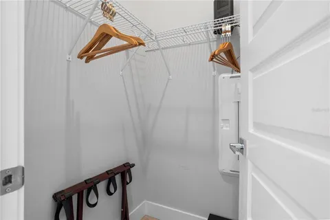 a bathroom with a granite countertop toilet sink and mirror