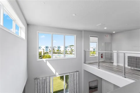a living room with pool table and a couch