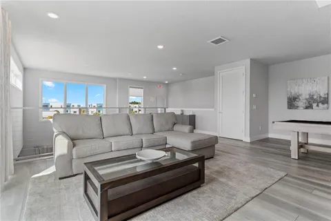 a bedroom with bed and painting on the wall