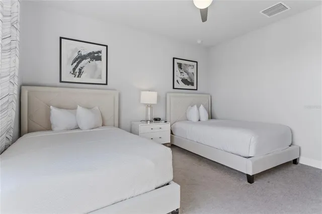 a view of a dining room with furniture and a floor to ceiling window