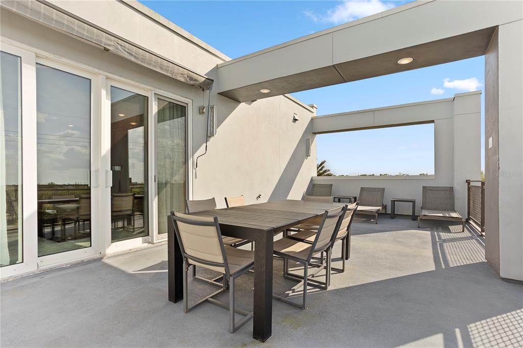 7770 Sandy Ridge Drive, Unit 207 Reunion, FL 34747 - Photo 42 of 61 a view of a patio with table and chairs
