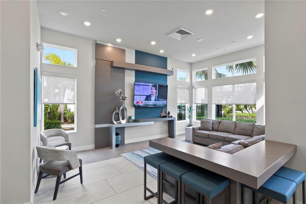 7770 Sandy Ridge Drive, Unit 207 Reunion, FL 34747 - Photo 55 of 61 a living room with furniture and a table