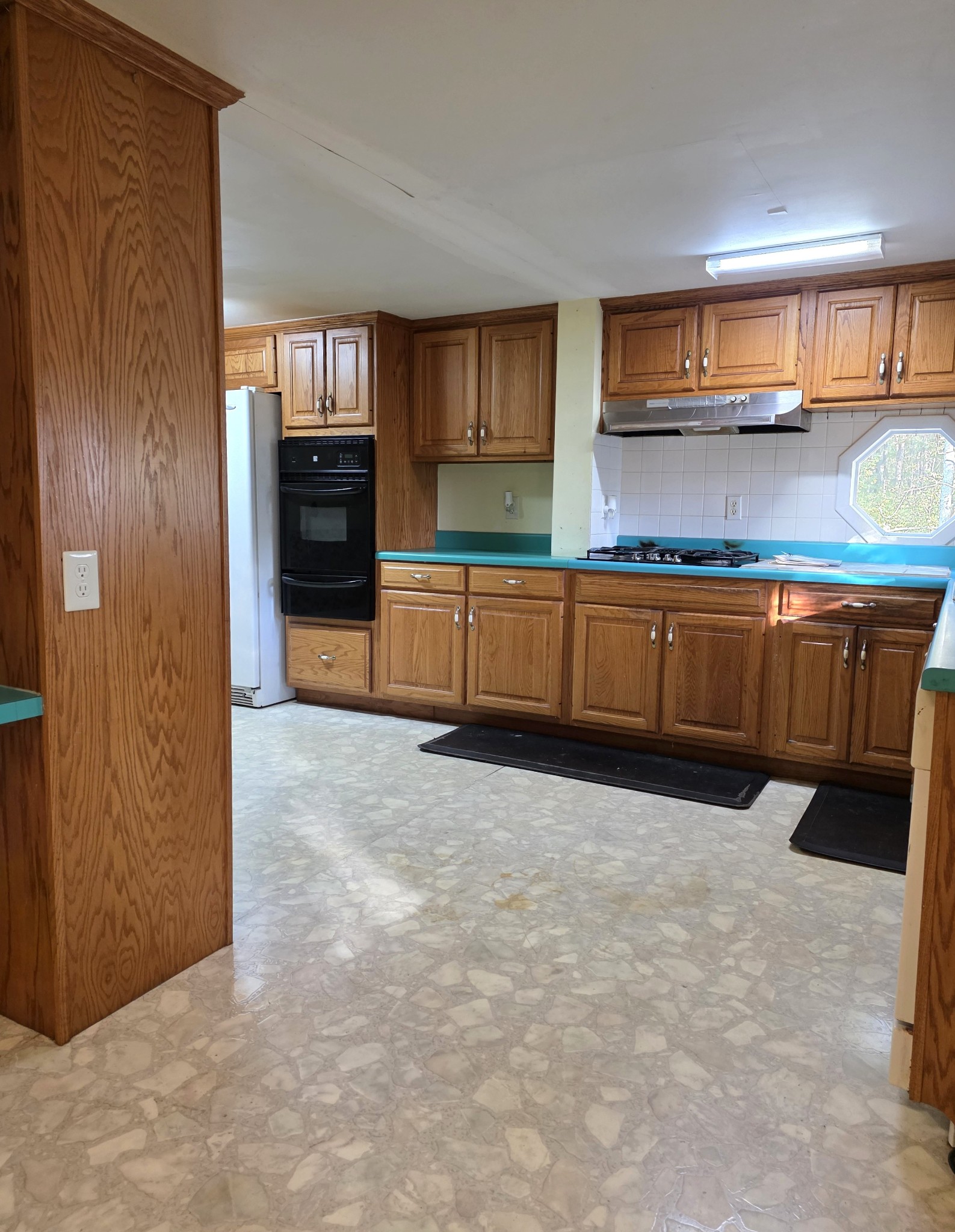 1117 Essie Cleek Road Tullahoma, TN 37388 - Photo 15 of 29 a kitchen with stainless steel appliances granite countertop a refrigerator and stove