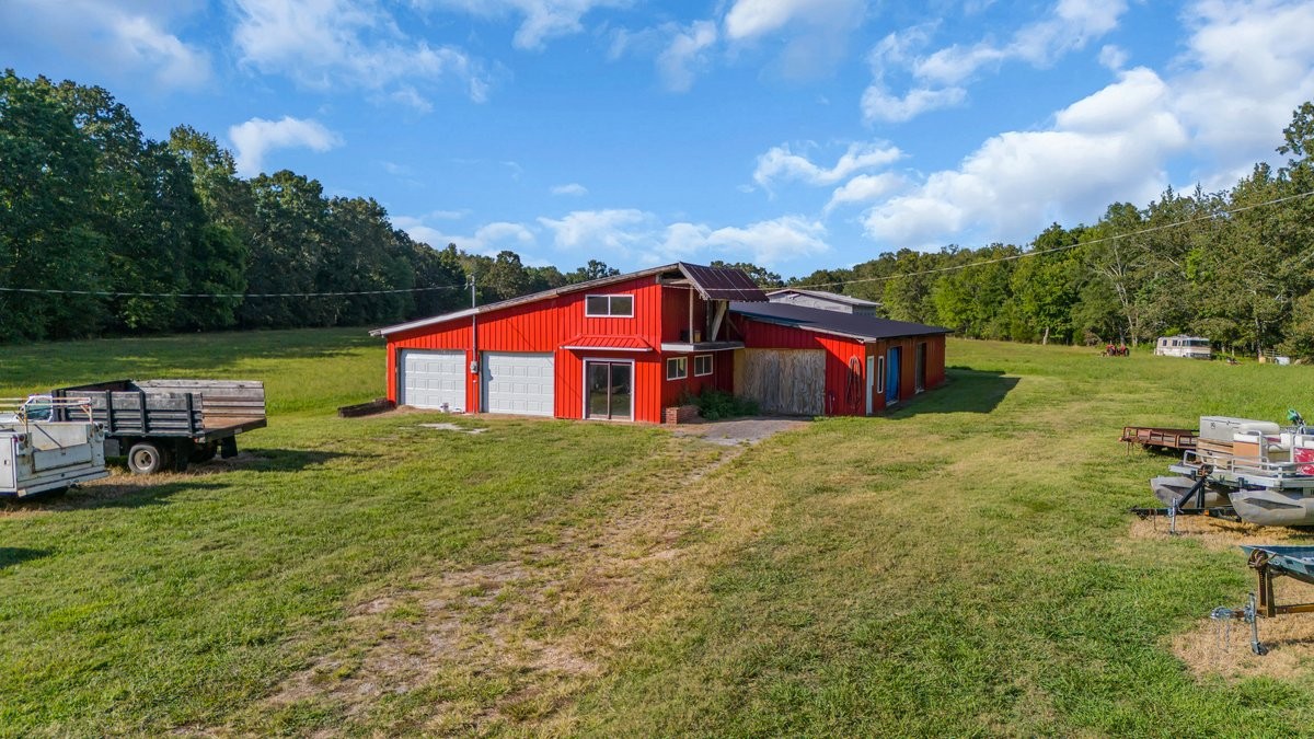1117 Essie Cleek Road Tullahoma, TN 37388 - Photo 4 of 29 a view of backyard with swimming pool and outdoor seating