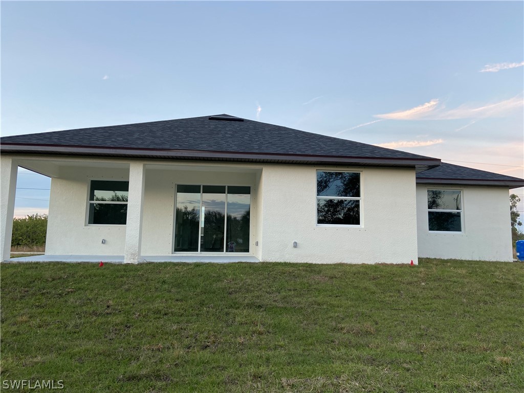 5029 Bristo Street Lehigh Acres, FL 33971 - Photo 14 of 14 a front view of house with yard