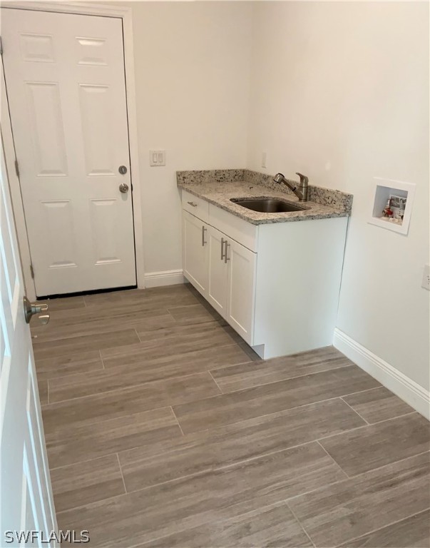 5029 Bristo Street Lehigh Acres, FL 33971 - Photo 8 of 14 wooden floor in an empty room