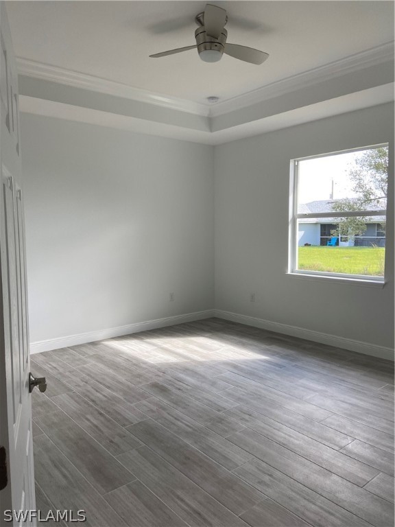 5029 Bristo Street Lehigh Acres, FL 33971 - Photo 9 of 14 wooden floor in an empty room