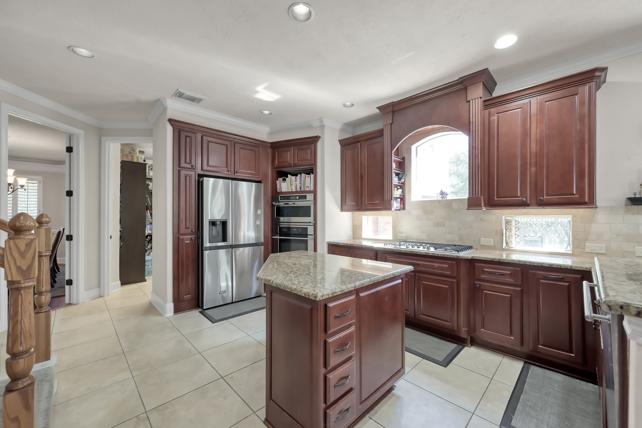 50 Cove View Trail Court Spring, TX 77389 - Photo 5 of 15 a kitchen with stainless steel appliances granite countertop a stove refrigerator and cabinets