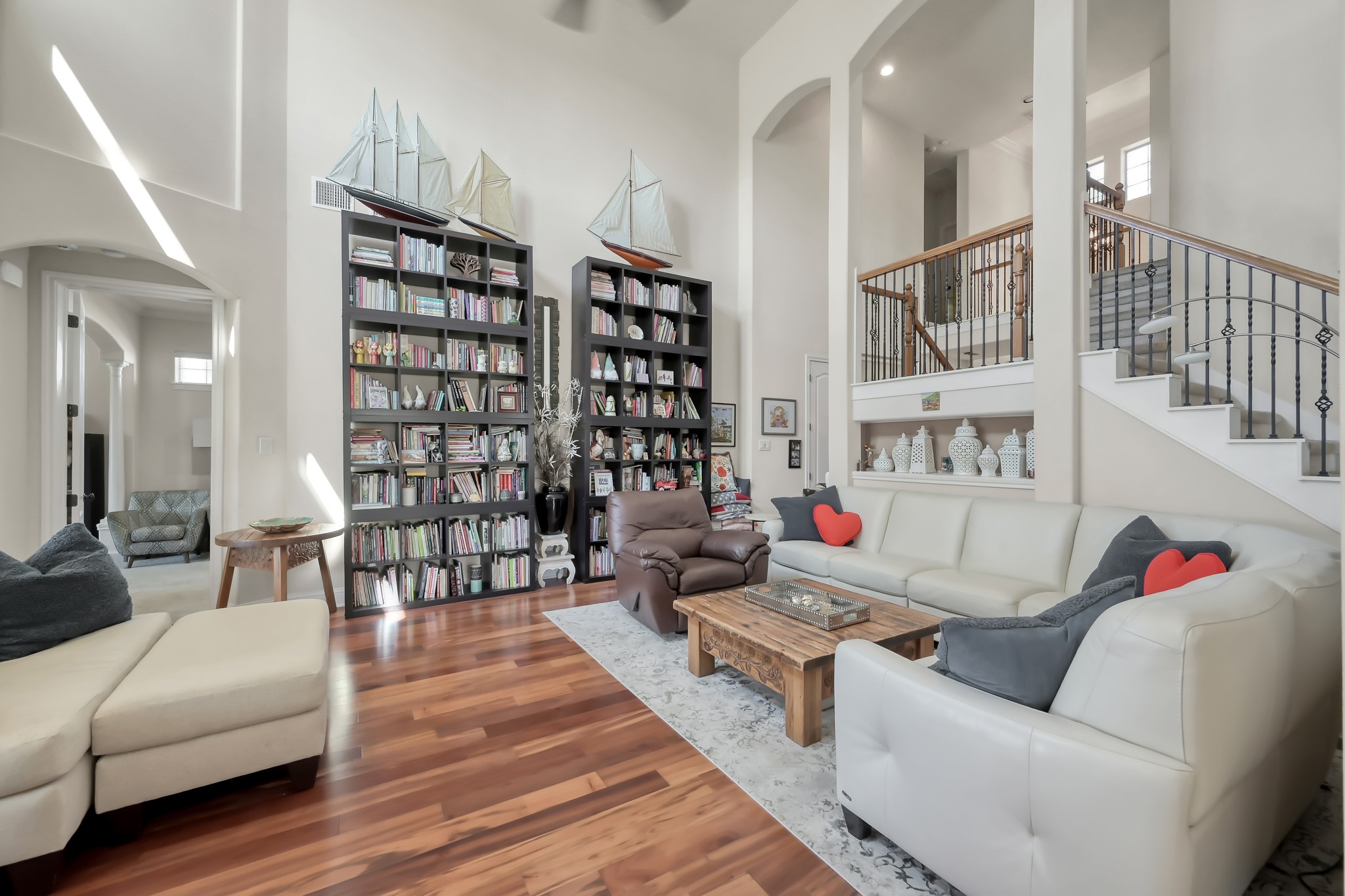 50 Cove View Trail Court Spring, TX 77389 - Photo 7 of 15 a living room with furniture and a book shelf