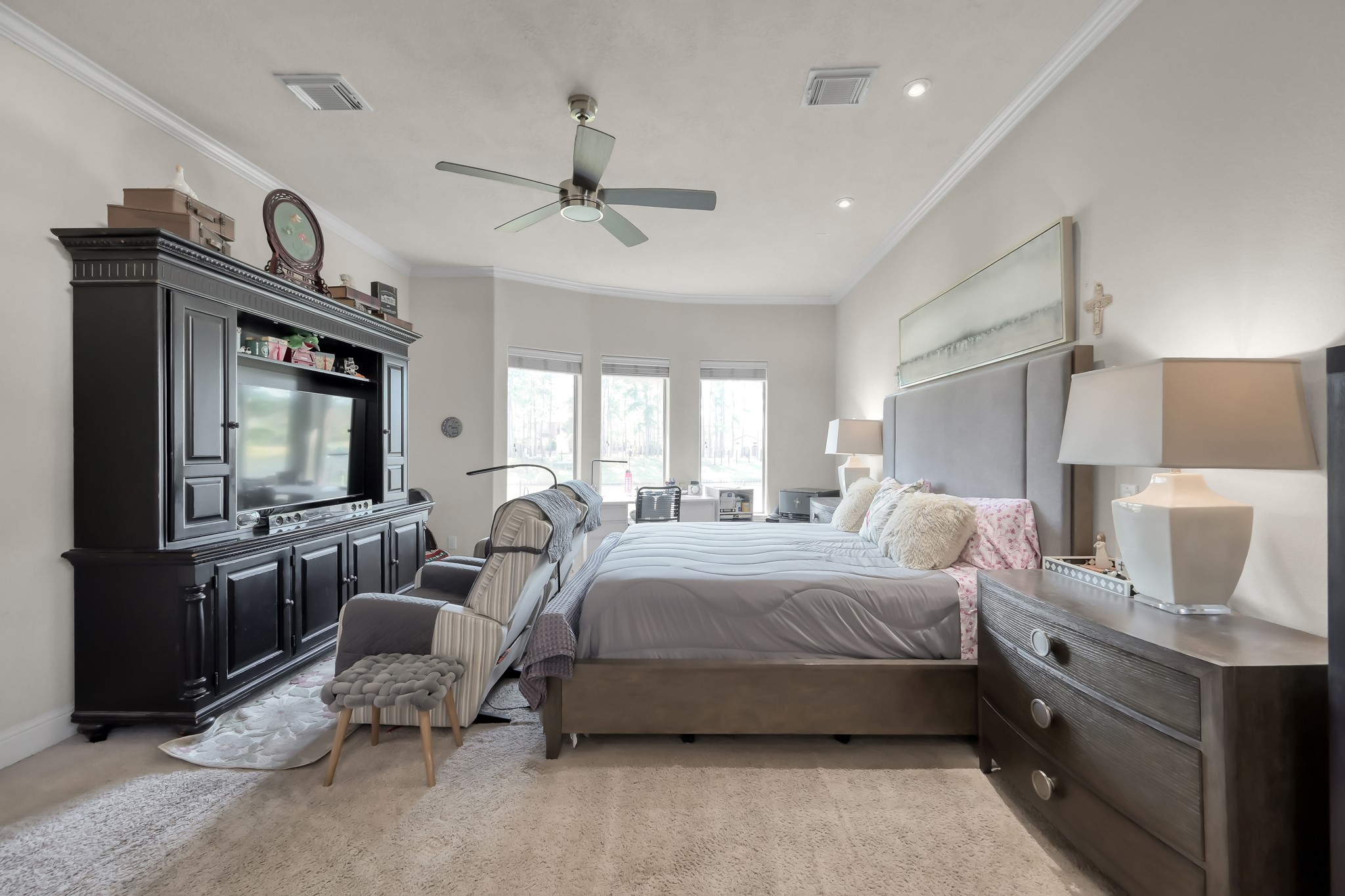 50 Cove View Trail Court Spring, TX 77389 - Photo 9 of 15 a spacious bedroom with a bed a couch and dresser
