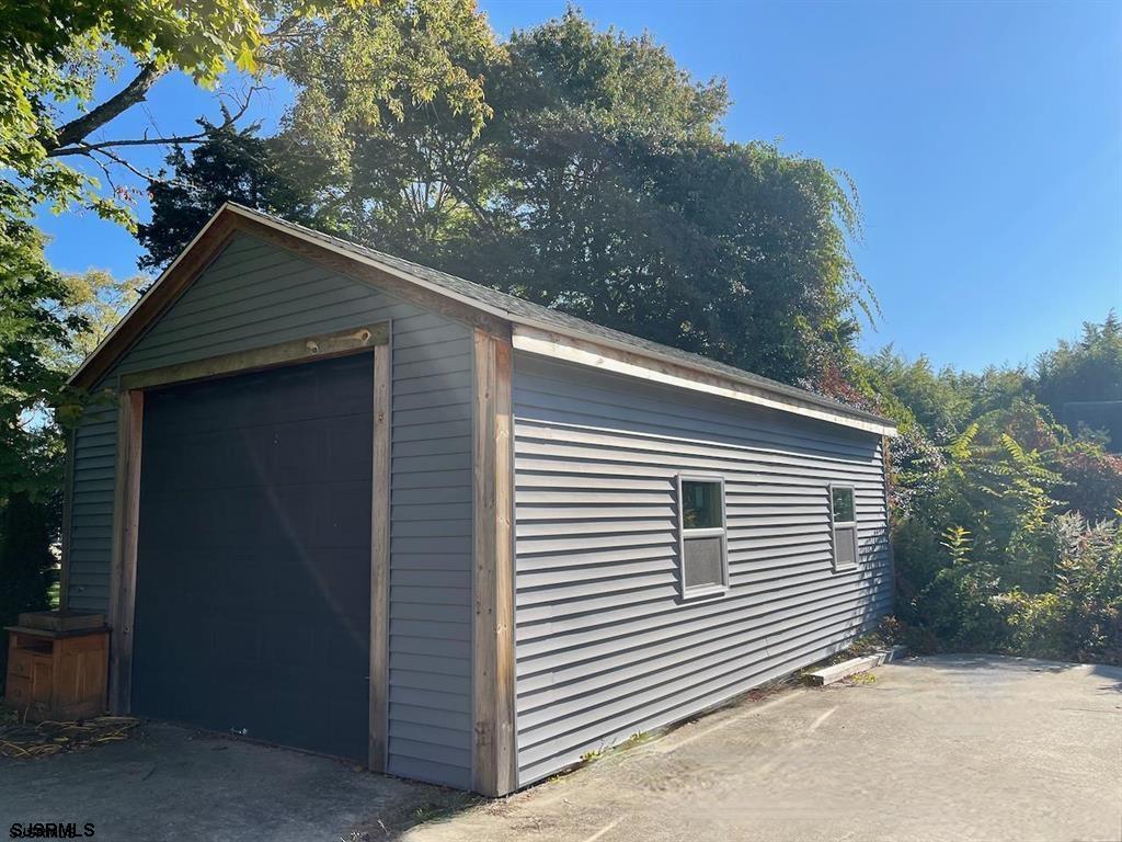 1050 Shore Road Linwood, NJ 08221 - Photo 5 of 6 a house that has a tree in front of the house