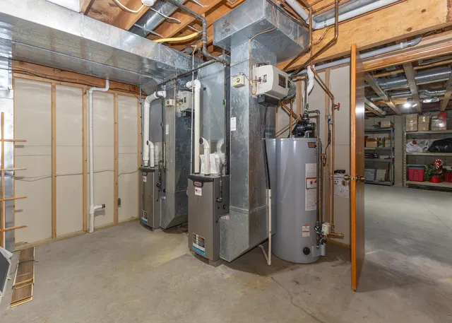 a view of a garage with storage and utility