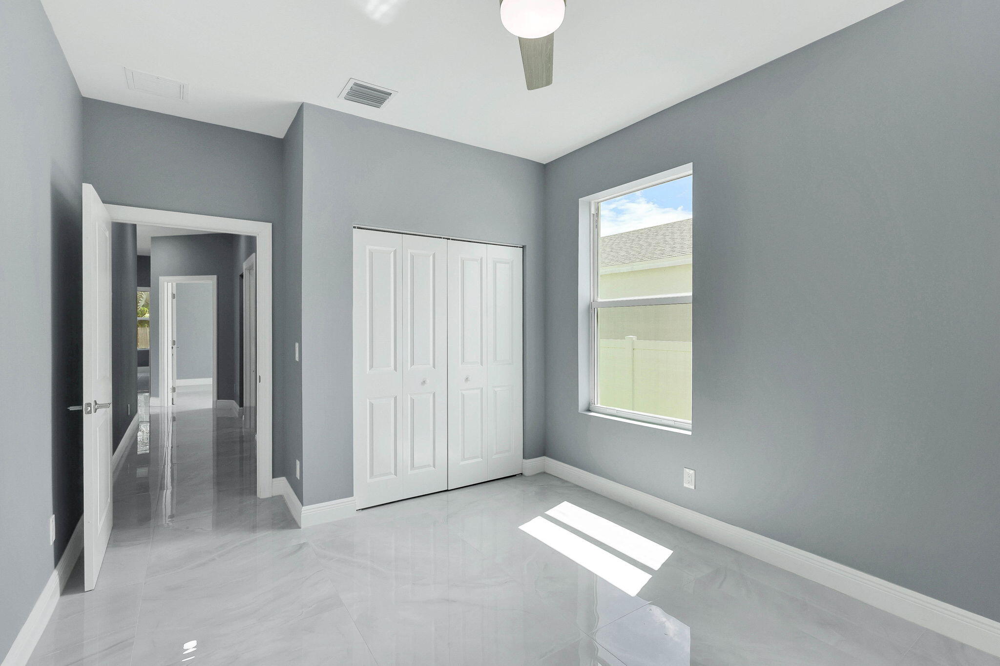 1749 Southwest California Boulevard Port St. Lucie, FL 34953 - Photo 20 of 33 an empty room with windows and closet