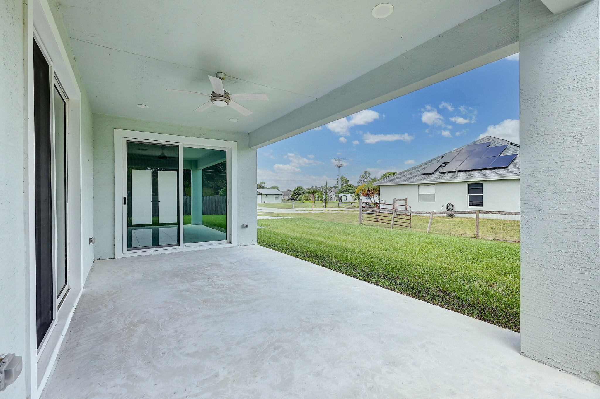 1749 Southwest California Boulevard Port St. Lucie, FL 34953 - Photo 22 of 33 a view of a house with backyard and porch