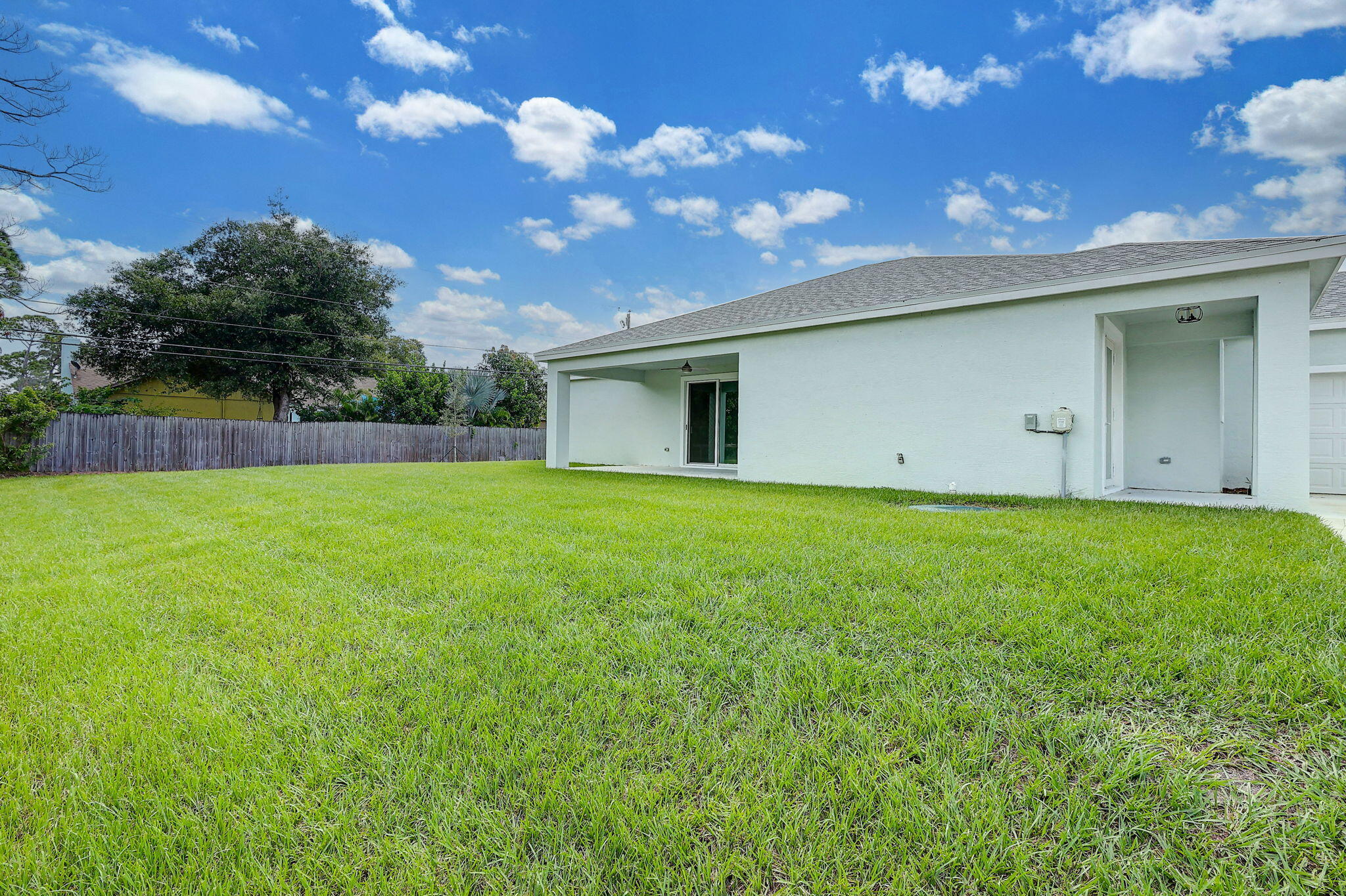 1749 Southwest California Boulevard Port St. Lucie, FL 34953 - Photo 25 of 33 a view of a backyard with a garden